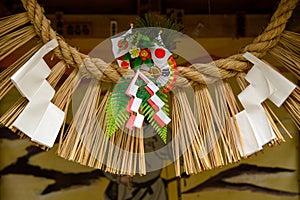 Shimenawa and shide at roadside Shinto shrine, Takachiho, Japan