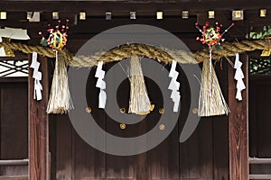 `Shimenawa`  Shinto straw festoon  in the japanese shrine.