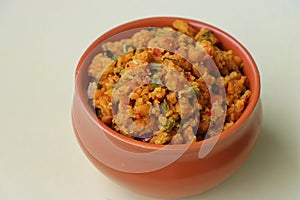 Shimla Mirch Zunka, Besan Capsicum Sabzi, a spicy Maharashtrian dish, served with bhakri or chapati