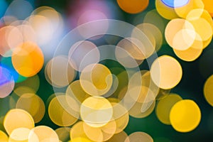 Shimmering abstract colored circles defocused christmas lights background. Blurred fairy lights. Out of focus holiday background