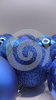 Shimmering Blue Christmas Ornaments on White Background, shiny blue balls