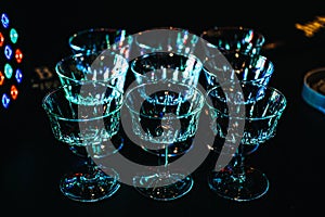 Shimmering Glassware in the Vibrant Ambiance of a Cocktail Party