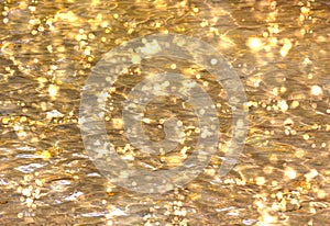 Shimmering Gold Water Bokeh Background