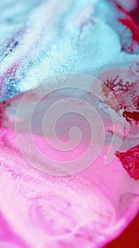 Shimmering ink background wet pigment white red