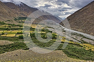 Shimshal village located on the river valley of the same name at the beginning of the alpine roads to the high peaks of over 6000, photo