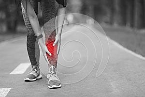 Shin Splints Injury. Female Athlete Massaging Injured Leg, Suffering Trauma During Jogging