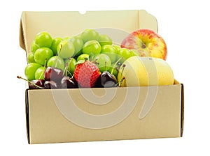 Shine Muscat grape, strawberry, cherries, chinese pear and apple in brown box isolated.