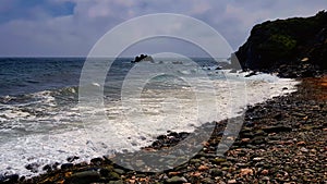 Shingle beach on rugged Cornish Coast