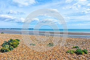Sandwich Bay shingle beach low tide Kent UK