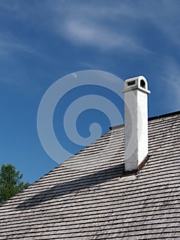 Shingle roof, with chimney and moon