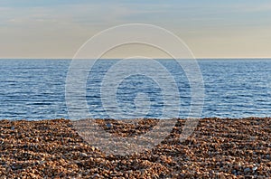 Shingle, sea and sky. Seatown, Dorset, England. Background. photo