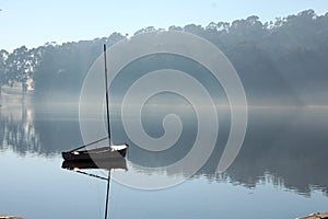 Shining boot in the mist on Tandil lake