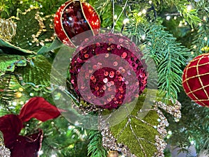 Shining christmas tree with red ball