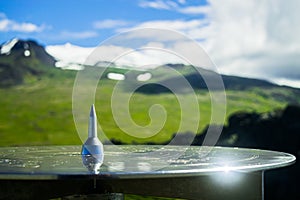 Shining compass on top of a crater in Snaefellsjokull National Park