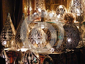 Shining lanterns in khan el khalili souq market with Arabic handwriting on it in egypt cairo