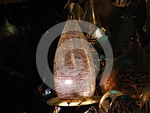 Shining lanterns in khan el khalili souq market with Arabic handwriting on it in egypt cairo