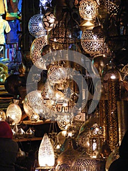 Shining lanterns in khan el khalili souq market with Arabic handwriting on it in egypt cairo