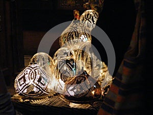 Shining lanterns in khan el khalili souq market with Arabic handwriting on it in egypt cairo photo