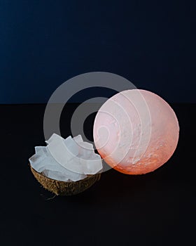 Shining moon and coconut bowl with melting ice