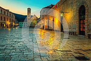 Shining paved walkway with Svetog Stjepana cathedral, Hvar, Dalmatia, Croatia