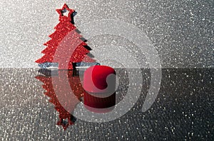 shining red christmas tree on silver background. snow effect