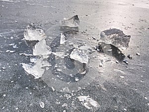 Shining shards of broken ice. Abstract still life of ice floes.