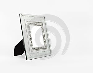 A shining silver picture frame on white background