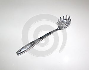 A shining stainless steel vegetables spoon isolated on white background