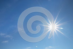 Shining sun at clear blue sky with free text space