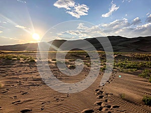 Shining sun in sky at Great Sand Dunes in Colorado