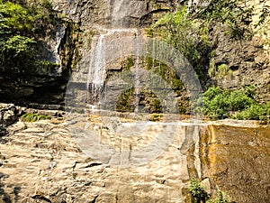 Shining waterfall on beautiful rock