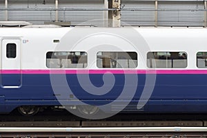 Shinkansen train chassis is parking at station.