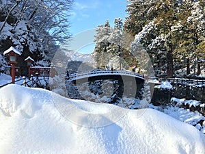 Shinkyo red bridge under white snow in Nikko Japan