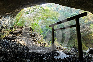 Shinto shrine gateway in the cave photo