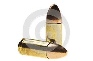 Shiny 9 mm caliber Bullets. Close-up of a 9mm full metal jacket ammo isolated on white background