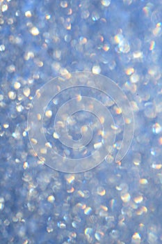 Shiny blue background round sequins blurred Defocused