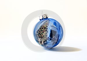 Shiny Blue Holiday Ornament Reflects Brightly Lit