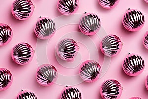 Shiny Christmas balls for decoration on pink background , new year pattern