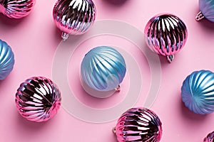 Shiny Christmas blue and pink balls for decoration on pink background , new year ball