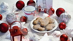 Shiny Christmas decoration with silver gifts red bubbles and home-made cookies