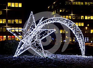 Shiny christmas street decoration in the shape of a comet made o