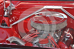 Shiny chromed engine of old red truck