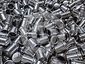 Shiny cold deformated cylindrical steel parts background photo