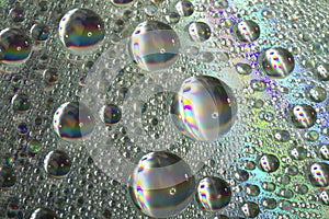 Shiny colorful drops of water