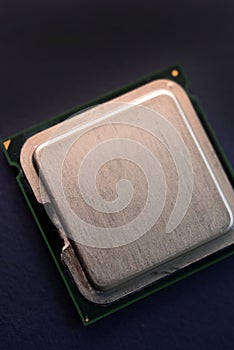The shiny cover of the computer processor. Multiple processors on a blue background. Computer details