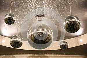 Shiny disco balls on the ceiling in the hall