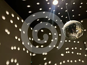 Shiny disco balls on a grey background. Beautiful Restroom