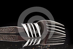 Fork on black background