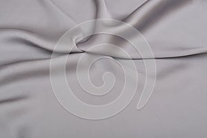 Shiny elegant silver satin silk fabric background