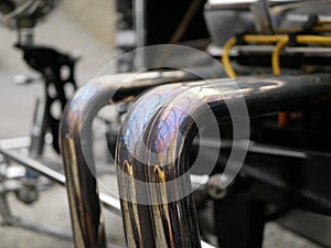 Shiny exhaust pipe of the car changed color due to the high exhaust gas temperature